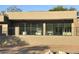 Stunning home featuring large windows, a stucco exterior, and a fenced patio with an outdoor ceiling fan at 3703 S Avenida De Angeles --, Gold Canyon, AZ 85118