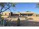 Exterior view of modern home featuring a rooftop terrace, desert landscaping, and a stucco exterior at 3703 S Avenida De Angeles --, Gold Canyon, AZ 85118