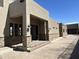 Expansive exterior featuring stone accents, exterior lighting, and a long driveway leading to the home at 3703 S Avenida De Angeles --, Gold Canyon, AZ 85118