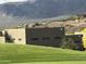 Stunning contemporary home with mountain views and lush green lawn in a scenic desert community at 3703 S Avenida De Angeles --, Gold Canyon, AZ 85118