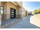 Stately front entrance with a modern design, featuring stone accents and a well-manicured walkway at 3703 S Avenida De Angeles --, Gold Canyon, AZ 85118