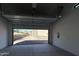 Spacious garage featuring an automatic door opener and ample room for multiple vehicles and storage solutions at 3703 S Avenida De Angeles --, Gold Canyon, AZ 85118