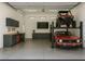 Spacious garage with car lift, work area, and storage providing ample space for hobbies and vehicles at 3703 S Avenida De Angeles --, Gold Canyon, AZ 85118