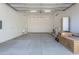 Large, unfinished garage space ready for customization, featuring bright lighting and room for projects at 3703 S Avenida De Angeles --, Gold Canyon, AZ 85118