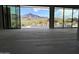 Open concept living space with expansive sliding doors framing spectacular mountain and desert views at 3703 S Avenida De Angeles --, Gold Canyon, AZ 85118