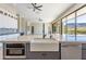 Beautiful modern kitchen island with sink and stainless steel appliances, and seamless doors to the patio at 3703 S Avenida De Angeles --, Gold Canyon, AZ 85118