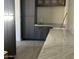 Modern kitchen features sleek dark cabinetry and expansive marble countertops at 3703 S Avenida De Angeles --, Gold Canyon, AZ 85118