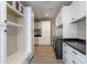 Spacious laundry room with plenty of storage, white cabinets, and modern washer and dryer at 3703 S Avenida De Angeles --, Gold Canyon, AZ 85118
