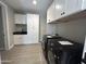 Laundry room featuring washer and dryer, sink, black countertop, and white cabinets at 3703 S Avenida De Angeles --, Gold Canyon, AZ 85118