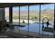 Great room has mountain views through windows, highlighting a serene atmosphere at 3703 S Avenida De Angeles --, Gold Canyon, AZ 85118