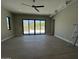 Bright living room with ceiling fan and sliding glass doors leading to the outdoor patio at 3703 S Avenida De Angeles --, Gold Canyon, AZ 85118
