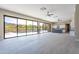 Spacious open floorplan featuring seamless indoor-outdoor living with pool and mountain views through large glass doors at 3703 S Avenida De Angeles --, Gold Canyon, AZ 85118