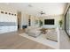 Bright, expansive living room with hardwood floors, contemporary decor, and seamless flow into the kitchen, perfect for gatherings at 3703 S Avenida De Angeles --, Gold Canyon, AZ 85118