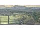 Scenic view of golf course community with mountains and luxury homes in the distance at 3703 S Avenida De Angeles --, Gold Canyon, AZ 85118