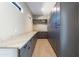 Spacious pantry with sleek gray cabinets, marble countertops and tile floors, offering plenty of storage space at 3703 S Avenida De Angeles --, Gold Canyon, AZ 85118