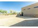 Large parking area with gravel surface and low wall providing practical space for vehicles at 3703 S Avenida De Angeles --, Gold Canyon, AZ 85118