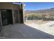 Spacious, tiled patio with access to a bathroom and mountain views beyond the fenced in property at 3703 S Avenida De Angeles --, Gold Canyon, AZ 85118