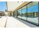 Modern patio with sleek glass sliding doors overlooking the pool and desert landscaping at 3703 S Avenida De Angeles --, Gold Canyon, AZ 85118