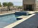 Modern pool featuring tiled spa, in-pool seating and contemporary architecture at 3703 S Avenida De Angeles --, Gold Canyon, AZ 85118