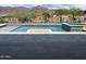 Inviting pool featuring stone accents, in-ground spa and scenic mountain views at 3703 S Avenida De Angeles --, Gold Canyon, AZ 85118