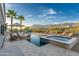 Inviting pool and spa with desert mountain views and outdoor seating for relaxing by the water at 3703 S Avenida De Angeles --, Gold Canyon, AZ 85118