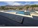 Inviting pool featuring stone accents, in-ground spa and scenic mountain views at 3703 S Avenida De Angeles --, Gold Canyon, AZ 85118