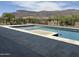 Inviting pool featuring stone accents, in-ground spa and scenic mountain views at 3703 S Avenida De Angeles --, Gold Canyon, AZ 85118