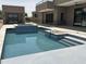 Modern pool featuring tiled spa, in-pool seating and contemporary architecture at 3703 S Avenida De Angeles --, Gold Canyon, AZ 85118