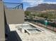 A backyard view shows the tilework being completed on a uniquely shaped pool and integrated hot tub at 3703 S Avenida De Angeles --, Gold Canyon, AZ 85118