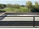 Flat rooftop featuring iron railing and views of the green golf course and manicured landscaping at 3703 S Avenida De Angeles --, Gold Canyon, AZ 85118