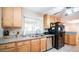 Kitchen with double sink, granite counters, and wood cabinets at 3716 W Augusta Ave, Phoenix, AZ 85051