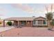 Single-story home with a carport and landscaped front yard at 4001 W Lupine Ave, Phoenix, AZ 85029