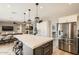 Modern kitchen with stainless steel appliances and a large island at 4019 E Paso Trl, Phoenix, AZ 85050