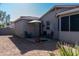 Relaxing backyard patio with seating and umbrella at 5185 S Eileen Dr, Chandler, AZ 85248