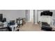 Home office features a workspace, treadmill, and ample storage at 5185 S Eileen Dr, Chandler, AZ 85248