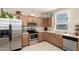 Kitchen with stainless steel appliances and wood cabinets at 5185 S Eileen Dr, Chandler, AZ 85248