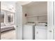 Convenient laundry room with washer, dryer, and shelving at 5185 S Eileen Dr, Chandler, AZ 85248