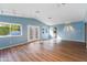 Bonus room with hardwood floors, vaulted ceilings, with great natural light from the windows and French doors at 6819 E Grandview Dr, Scottsdale, AZ 85254