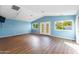 Bonus room with hardwood floors, vaulted ceilings, with great natural light from the windows and French doors at 6819 E Grandview Dr, Scottsdale, AZ 85254