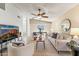 Bright living room featuring modern furnishings and decor, flowing into the dining area at 6819 E Grandview Dr, Scottsdale, AZ 85254