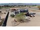 Expansive view of desert horse property with custom home, desert landscaping and fenced perimeter at 7214 N 183Rd Ave, Waddell, AZ 85355