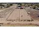 Aerial view of horse property and facilities with mountains in the background at 7214 N 183Rd Ave, Waddell, AZ 85355
