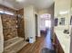 Bathroom with shower, tile floor, and view of bedroom at 9 N 226Th Cir, Buckeye, AZ 85326