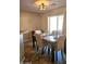 Dining area with marble top table and tan chairs at 9 N 226Th Cir, Buckeye, AZ 85326