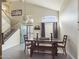 Dining room with wood table and view to entryway at 9216 W Sandra Ter, Peoria, AZ 85382