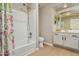 Clean bathroom, featuring a shower/tub combo and modern vanity at 9829 E Onza Ave, Mesa, AZ 85212