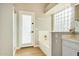 Bathroom with shower, bathtub, and a glass block window at 9829 E Onza Ave, Mesa, AZ 85212