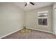 Bright bedroom with carpet flooring and a window allowing natural light at 9829 E Onza Ave, Mesa, AZ 85212
