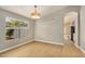 Light-filled dining room with wood flooring and views to the kitchen at 9829 E Onza Ave, Mesa, AZ 85212