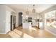 Modern kitchen with white cabinets, stainless steel appliances, and an island at 9829 E Onza Ave, Mesa, AZ 85212